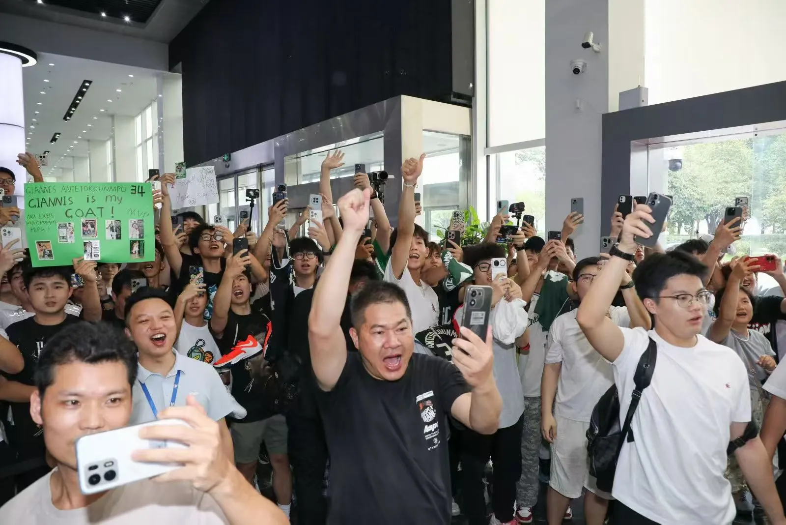 Fans taking photos at the showroom visit