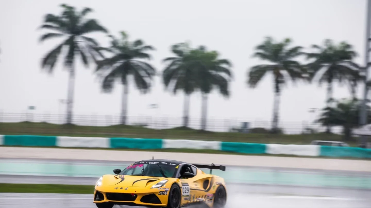 A Lotus race car at speed on the Sepang International Circuit